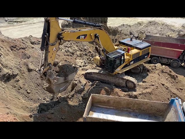 Caterpillar 385C Excavator Loading Mercedes & Man Trucks - Interkat SA
