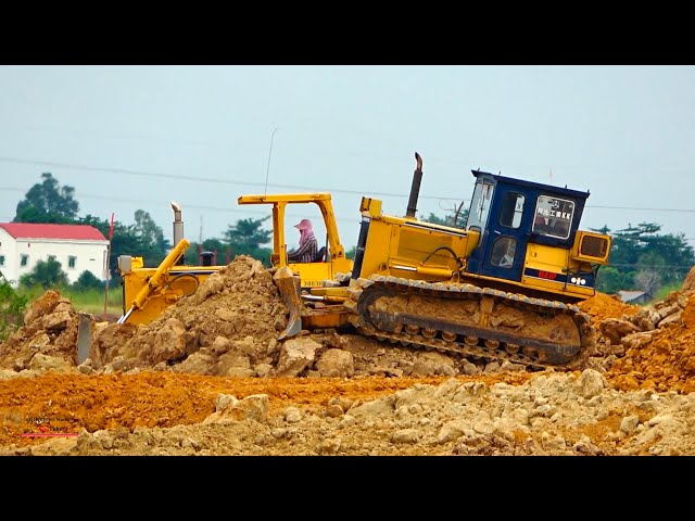 strong extreme komats'u bulldozer partner working truck dumper unload soils