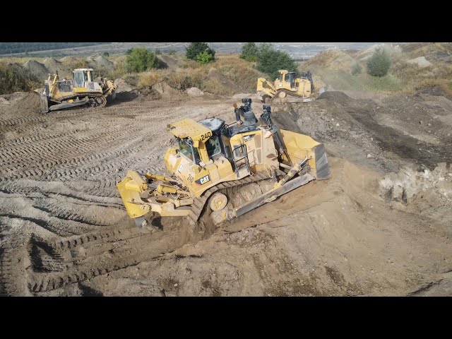 Two Caterpillar D9T Bulldozers And Komatsu D275AX Bulldozer Levelling A Huge Mining Site