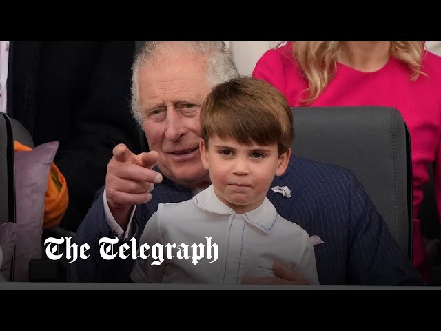 Mischievous Prince Louis sits on Prince Charles' lap during Queen's Platinum Jubilee Pageant