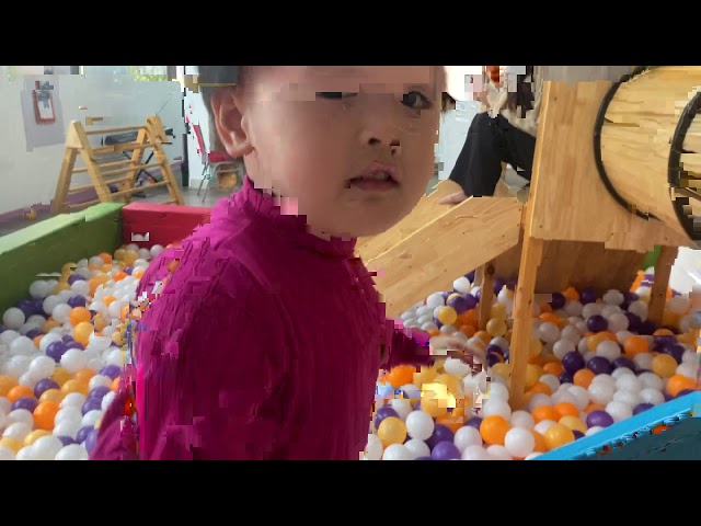 baby with playground for kids and balls pit