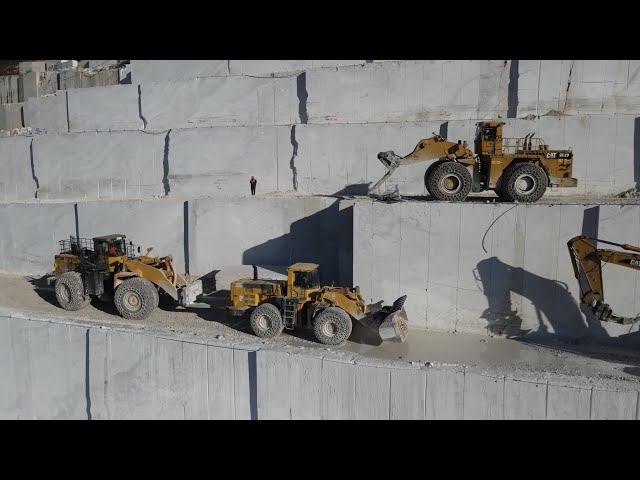Caterpillar And Komatsu Wheel Loaders Carrying Marble Columns In Birros Marble Quarries- Aerial View