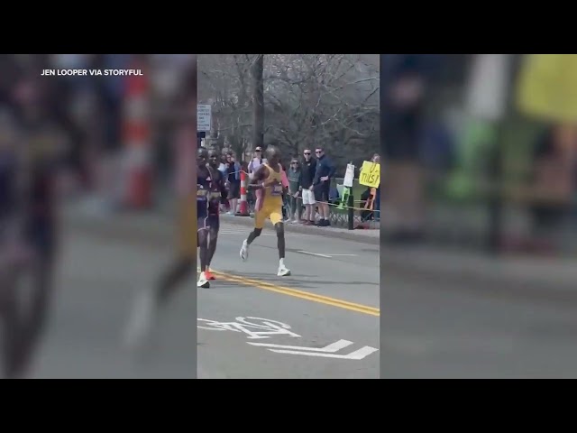 Crowd Cheers on Male Runners During Boston Marathon