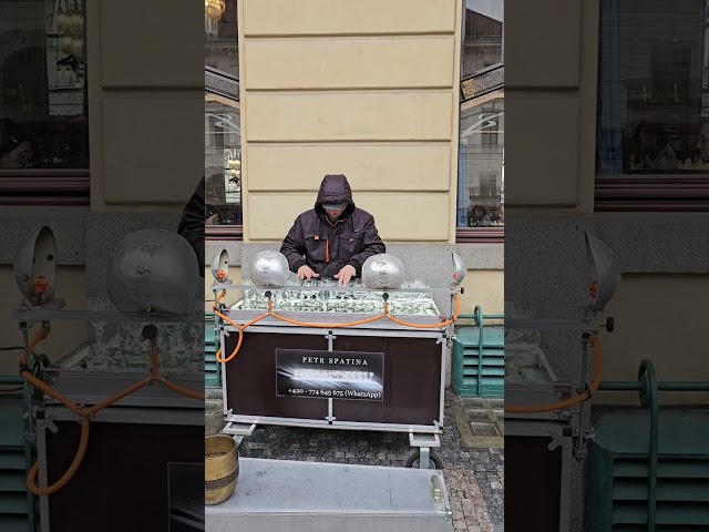 Man Plays Music with Crystal Glass on Street - 1498917