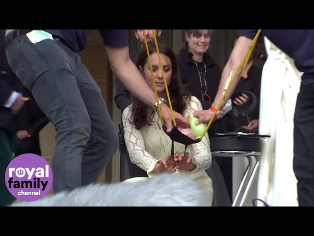 Kate  and Prince Harry shoot water balloons at Prince William