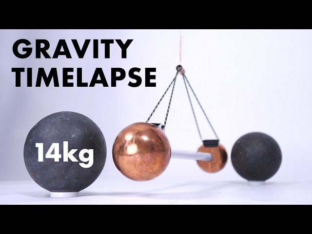 Watch gravity pull two metal balls together