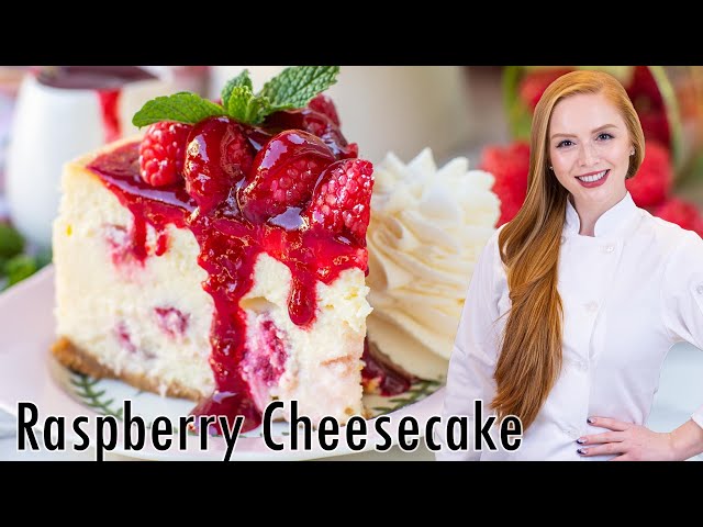 The BEST White Chocolate Raspberry Cheesecake - with raspberry sauce & whipped cream!