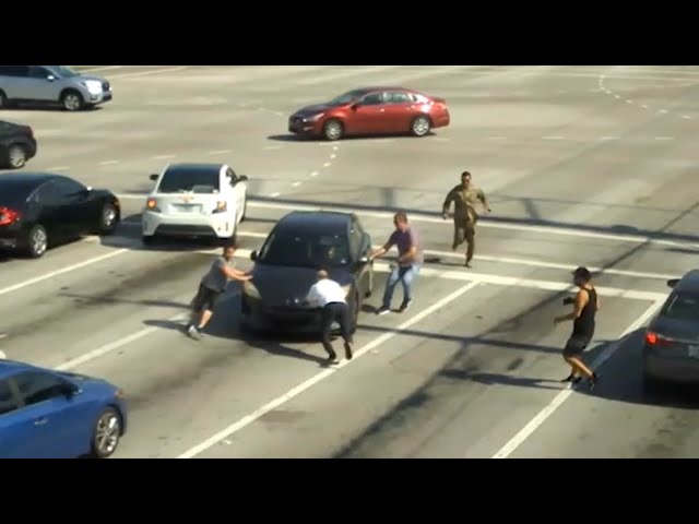 Good Samaritans get out of their cars to stop vehicle from drifting into busy Florida intersection