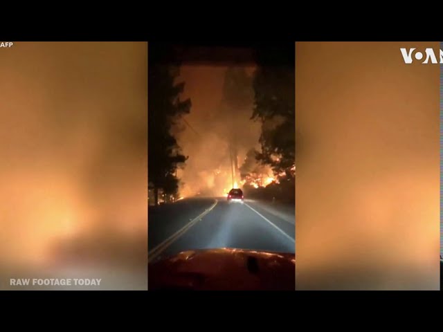 U.S. West Coast Wildfires: Car drives through Napa Valley fire