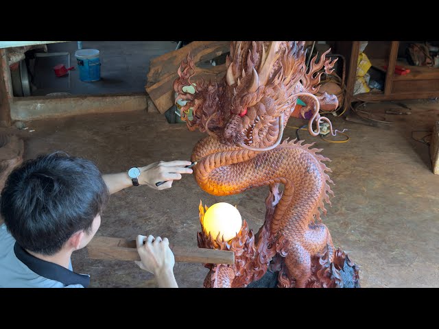 The carving process turns the tree stump into a dragon statue