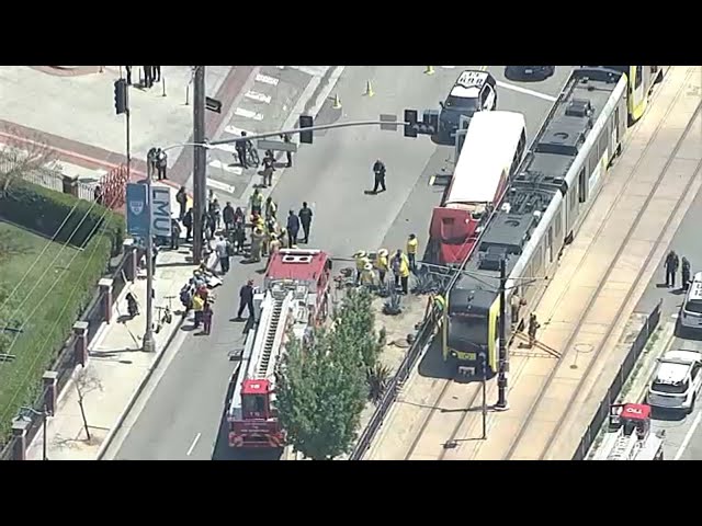 At least 55 people treated after Metro train crashes with USC bus in Southern California
