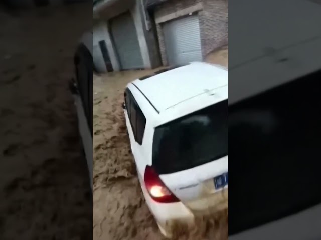 Horrific flooding sweeps away car in China