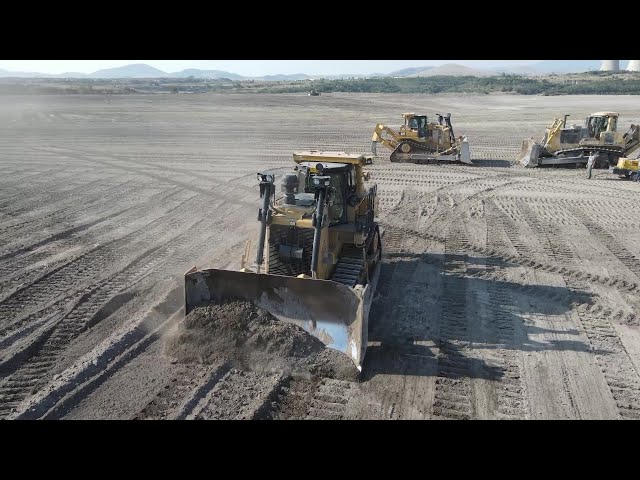 Caterpillar D9T Buldozers And Komatsu D275 Working On A Huge Mining Area