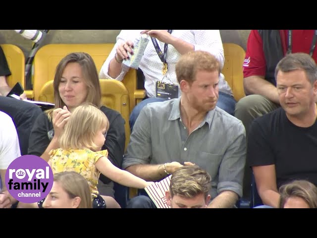 Sneaky toddler steals Prince Harry's popcorn