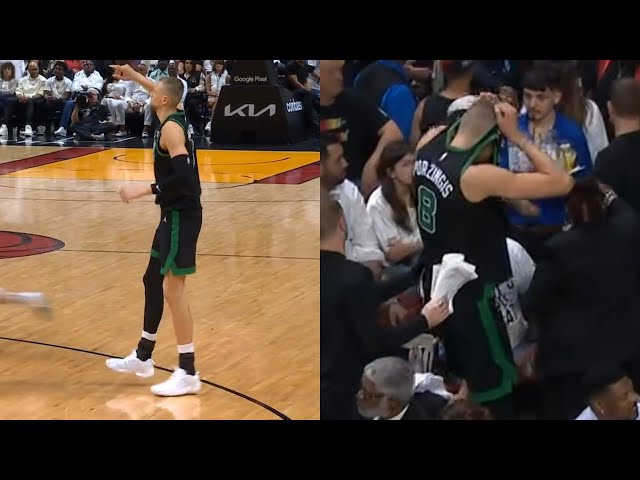 Kristaps Porzingis puts jersey over his head after scary non contact leg injury vs Heat 😬