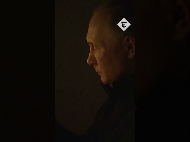 Vladimir Putin lights candle in memory of concert hall attack victims
