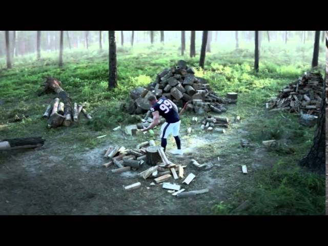 Verizon | A better network as explained by JJ Watt chopping wood in the middle of the forest.