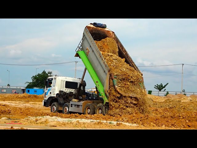 special​​ machines truck dumper spread soils equipment operating with bulldozer shantui dh17