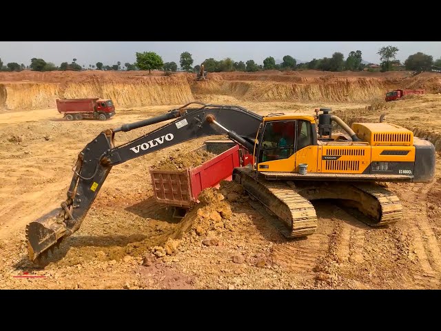 awesome power machines dirt removing into dump trucks operating with volvo excavator ec480dc