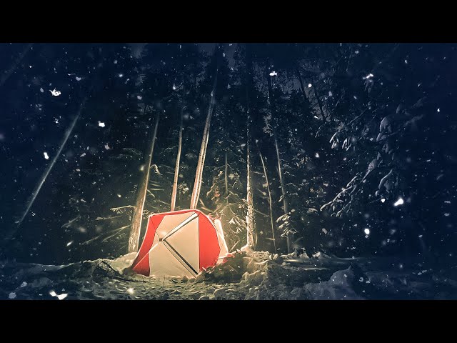 Winter camping in a tent with a stove. Overnight stay in the snowy forest. Tent for the apocalypse.