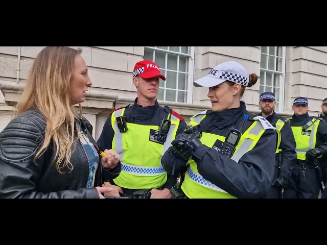 Police justify their huge presence by telling this patriot its to keep protesting groups apart.