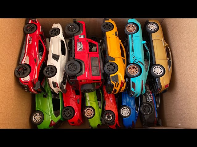 Collecting model cars from box, Lamborghini, camaro, porsche, volkswagen, honda fit.