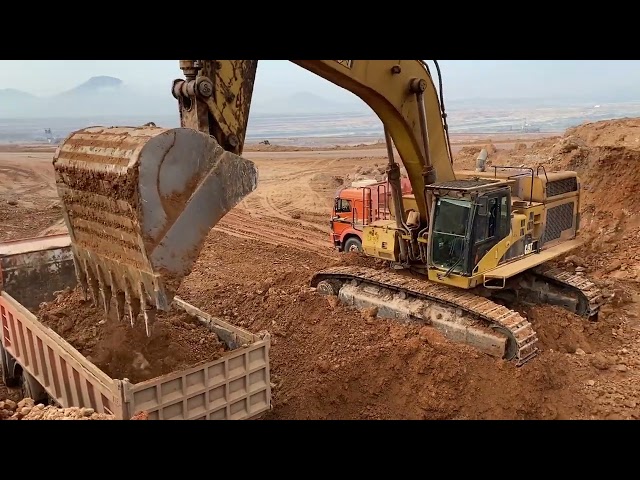 Caterpillar 365C Excavator Loading Trucks & Caterpillar D8 Bulldozer Helping With The Hard Ground