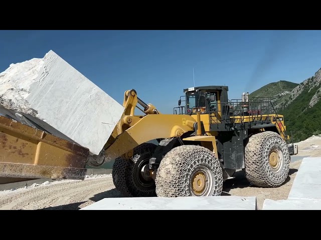 Komatsu Wheel Loaders Loading Huge Marble Blocks On Caterpillar Dumpers - Birros Marble Quarries