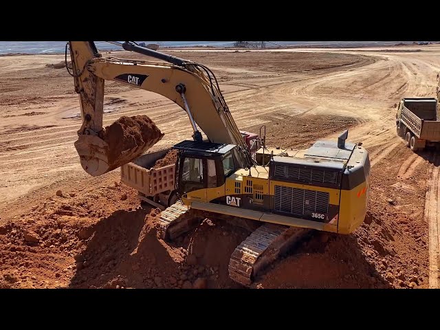 Caterpillar 365C Excavator Loading Mercedes & MAN Trucks