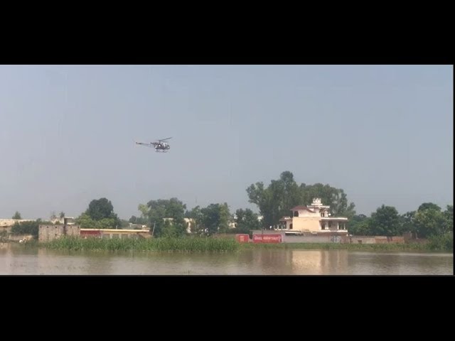 Jalandhar: A helicopter drops food packets on rooftop of flood victims