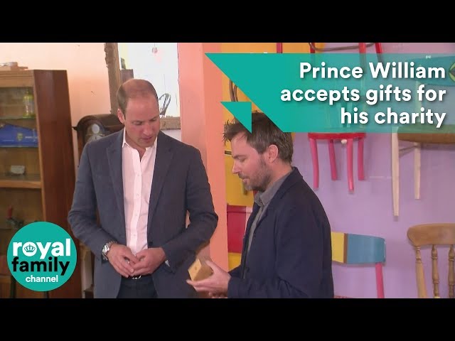 Prince William accepts gifts for his children at charity