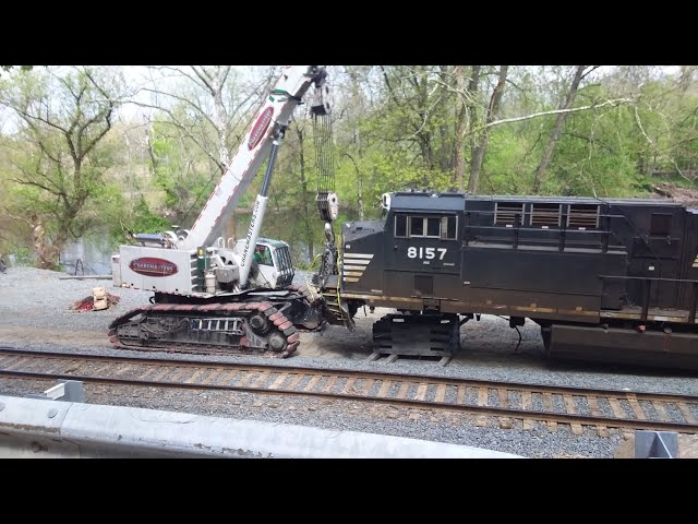 Wrecked engines from the 19G derailment being loaded onto flatcars!