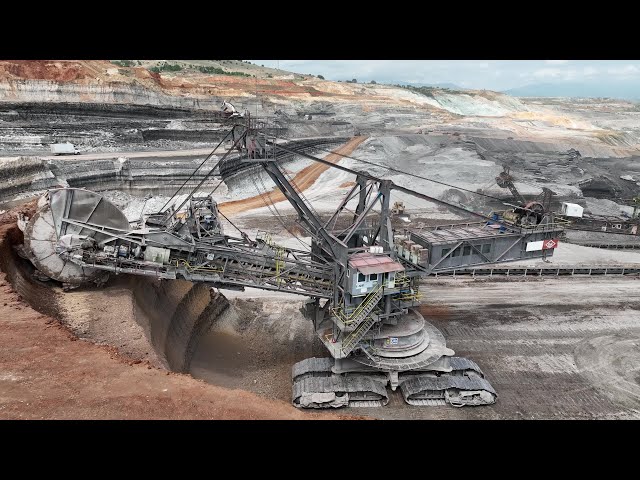 Huge Wheel Bucket Excavator Working On Coal Mines - Aerial View - 4k