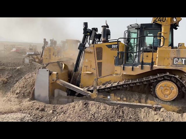 Caterpillar D9T And Komatsu D275AX Bulldozers Working On Huge Mining Site