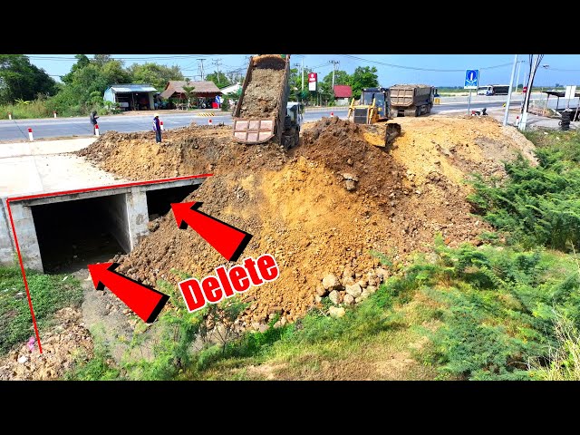 Massive Soil  Loading Dump Trucks Are Removed From Construction Using Skill Work Dozer KOMATSU D60P