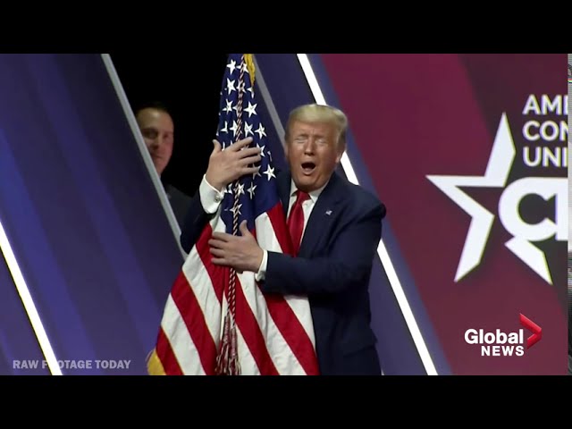 President Trump hugs, gives kiss to American flag at CPAC Conference