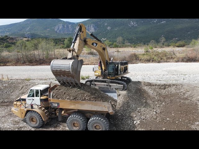 Caterpillar 374D Excavator Loading Caterpillar & Volvo Articulated Trucks - Interkat SA