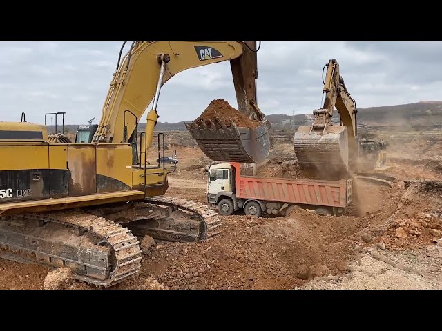 Two Caterpillar 365C Excavators Loading Mercedes & MAN Trucks With Three Passes