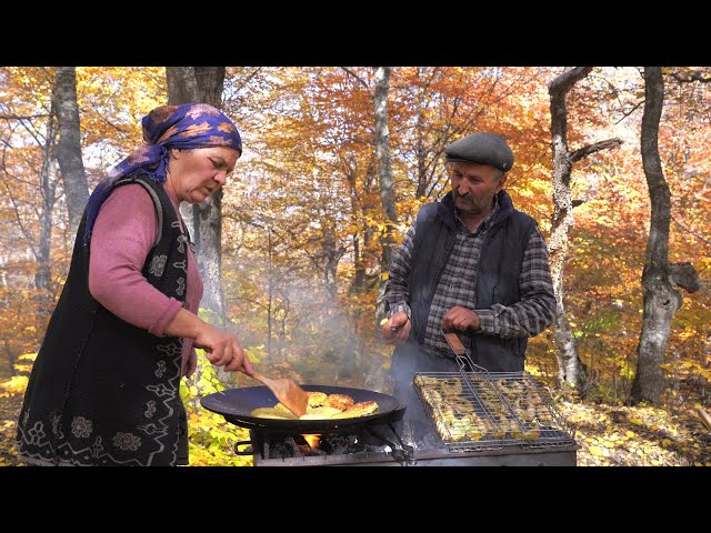 Cooking Whole Sturgeon Fish on Charcoal in the Forest