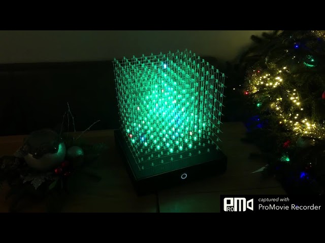 Happy new year, fireworks and christmass tree in RGB LED cube