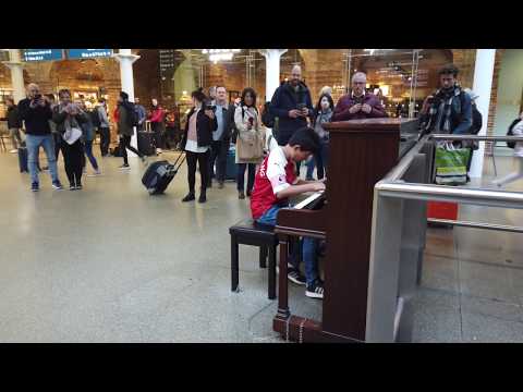 Young Football Fan Plays Bohemian Rhapsody Piano at Train Station Cole Lam 12 Years Old