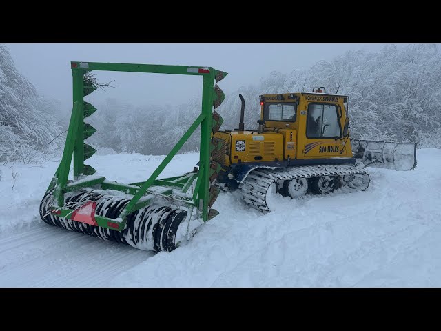 Grooming snowmobile trails
