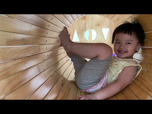 Baby cute at indoor playground with toys and balls