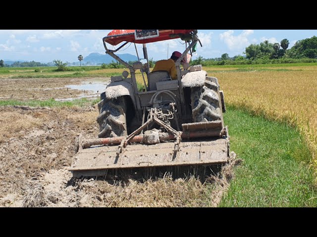 Incredible Kubota M6040SU Tractor Heavy Agriculture Equipment With Rotavator Vs. Muddy Field