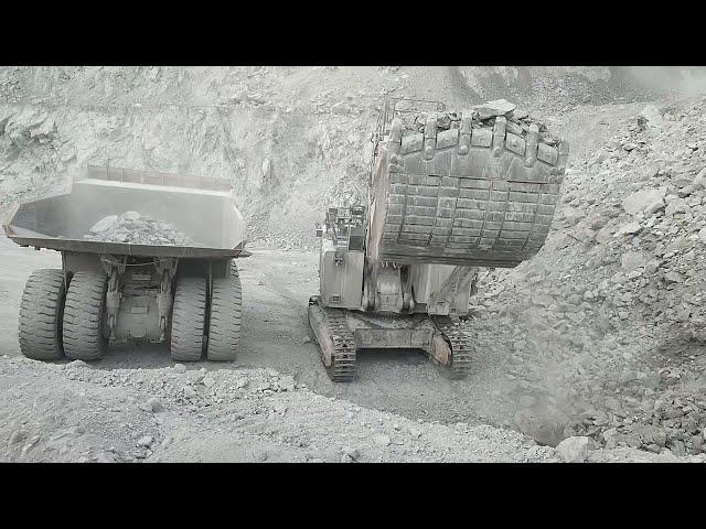Liebherr R9350 Excavator Loads Terex NTE240 Mining Truck Powerful Machines Working at Another Level