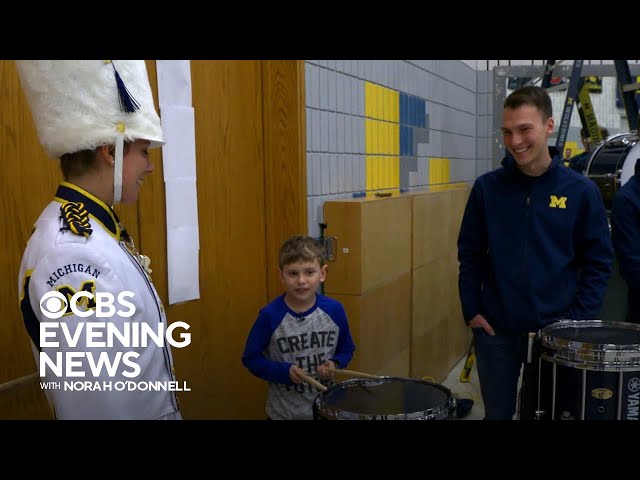 11-year-old boy surprised by Michigan marching band