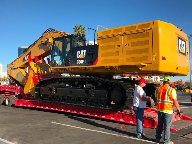Moving the massive Cat 390F excavator from Conexpo