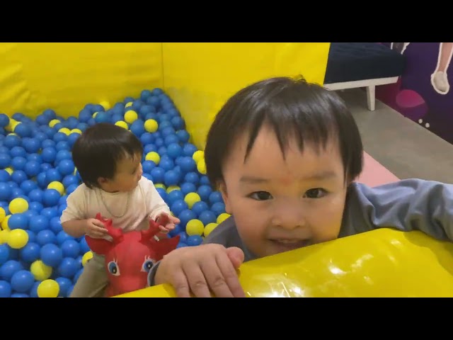 Baby cute with balls pit in house