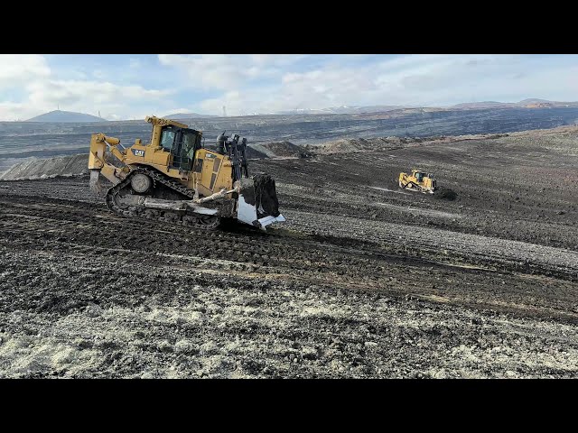 Two Caterpillar D9T Bulldozers Working On Huge Mining Area - 4k