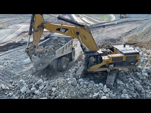 Caterpillar 385C Excavator Loading Caterpillar 775E Dumper And Mercedes-MAN Trucks - Pyramis Ate